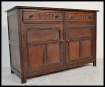 A 20th Century Jaycee / Old Charm oak sideboard credenza having two short drawers over cupboards