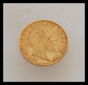 A 1904 Edward VII full gold sovereign stamped for the Melbourne mint. Weight 8.0g.