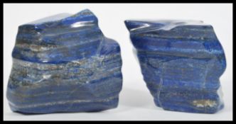 A pair of large and impressive Lapis Lazuli semi precious stone bookends of natural form.
