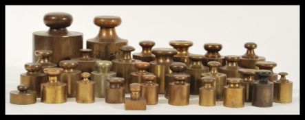 A large collection of antique brass and bronze weights dating from the 19th Century of various