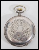 An early 20th Century Russian silver full hunter pocket watch having engraved decoration to the case