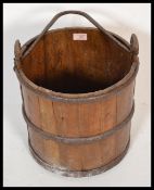 An early 20th Century coppered Chinese water pail / bucket,cast iron carry handle to the top with