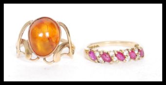 Two 9ct gold rings to include a hallmarked Art Nouveau style ring set with an orange stone