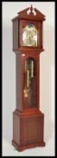 A 20th Century triple chime Westminster long case clock having a moon phase dial with roman numerals