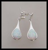 A pair of stamped 925 silver earrings set with opal panel drops. Stud backed. Weight 4.2g. Drops