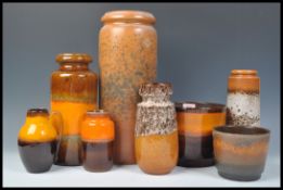 A collection of vintage retro 20th Century West German fat lava style pottery all in an orange