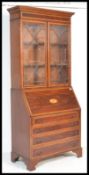A George III 18th century style mahogany and marquetry inlaid  bureau bookcase. Raised on bracket