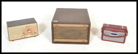 A vintage HMV portable record player with fitted Garrard RC 120 MKII four speed deck, together