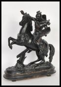 An early 20th Century bronze spelter statue figurine of Thor riding his horse with shield raised.