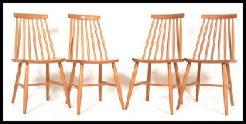 A set of four vintage retro 20th century Ercol style beech and elm Windsor dining chairs having