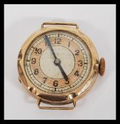 A hallmarked 9ct gold Art Deco watch having a silvered dial with gilt chapter ring and faceted