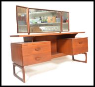 A vintage retro 20th Century teak wood Erst Gomme for G Plan dressing table, having an arrangement