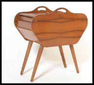 A vintage mid 20th Century black walnut concertina metamorphic work / sewing box, carry handles to