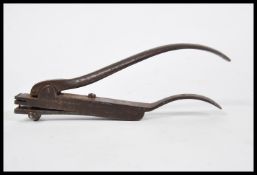 An early 20th Century Railway ticket inspector ticket punch of unusual form having shaped spring