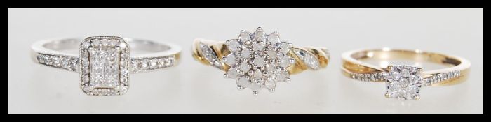 Three 9ct gold rings to include a white stone clus