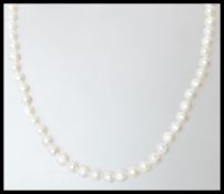 A fresh water pearl strung necklace having a silve
