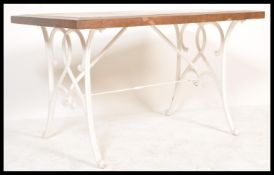 A vintage 20th Century garden table, cast iron bas