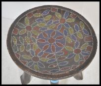 A 20th Century African hardwood stool carved from