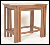 A vintage retro 20th Century teak wood nest of tab