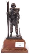 BRONZE 20TH CENTURY MILITARY FIGURE OF A SOLDIER WITH SKIS