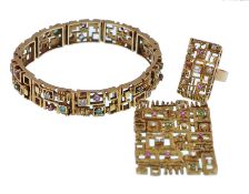 A 1970's suite of gold  ruby diamond emerald studded jewellery.  The suite to include a emerald