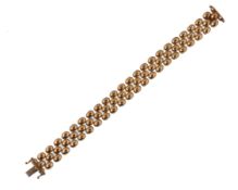 A LADIES 9CT GOLD IMPORT HALLMARKED PEBBLE BRACELET