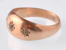 An early 20th century hallmarked 9ct rose gold and colourless paste 3 stone gypsy ring. Weight 1.8g,