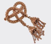 A 9ct gold ladies brooch of unusual form having cr