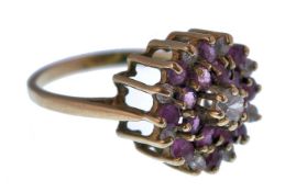 A 9CT GOLD RUBY AND DIAMOND LADIES CLUSTER RING