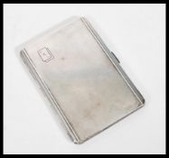 A silver hallmarked machine turned cigarette case,