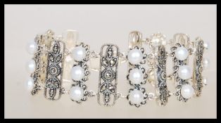 An Art Deco style panel bracelet having alternatin