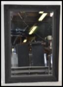 A antique style large ornate bevelled glass mirror