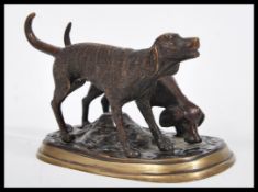 An early 20th Century bronze figurine group of hun