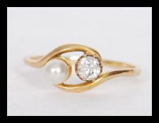 A 18ct gold ring prong set with a round cut diamon