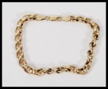 A hallmarked 9ct gold flat curb and belcher link b