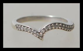 A hallmarked 9ct white gold wishbone ring having f