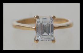 A hallmarked 9ct gold ring having a large emerald