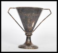 A silver hallmarked swimming trophy raised on a st