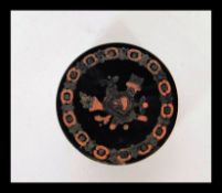 A 19th Century Georgian  tortoiseshell snuff pot, white metal inlaid central cartouche panel to