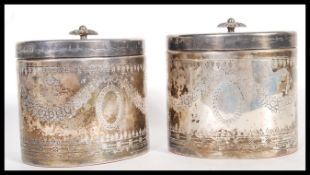 A matching pair of 20th Century Edwardian style tea caddies, of oval form having floral engraved