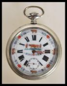 An early 20th century nickel cased enamel decorated plough dial being open faced with roman