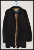 A gents designer Burberry 100% cotton short jacket / coat, the black jacket with the iconic Burberry