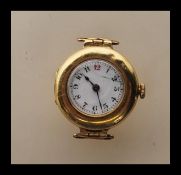An early 20th Century 18ct gold cased half hunter wrist watch having an 18 jewels Longines movement,