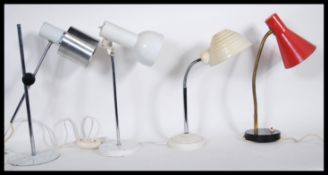 A collection of four retro vintage desk / table lamps, the lamps all fitted with conical shades to