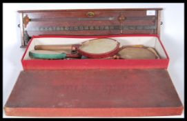 An early 20th Century boxed table tennis set by T Harris & Sons wine Street Bristol together with