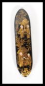 A 19th century papier mache black lacquer needle / pick holder being decorated with chinoiserie