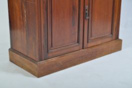 A 19th century Victorian walnut dresser base. Raised on squared plinth base with double door