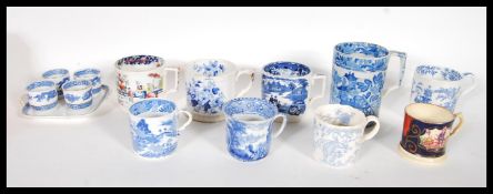 A collection of 19th Century Victorian Staffordshire mugs and cups, most having blue and white