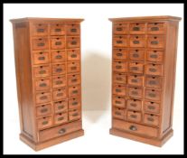 A pair of 20th century / contemporary hardwood Industrial 25 drawer pedestal chests. Each chest of