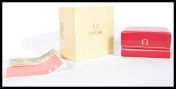A vintage 1970's Omega watch box having a hinge lid with gilt Omega logo to the box and interior,